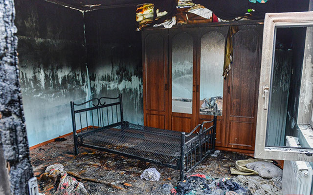 Qonşu qadının başını kəsib evini yandırdı - Gəncədə dəhşət