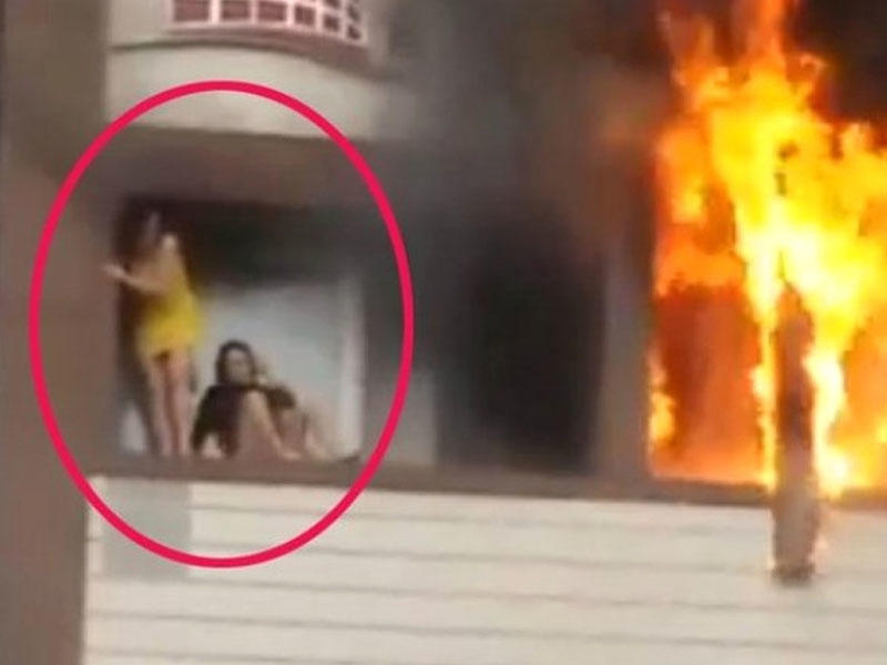 Özünü binadan atan qızı göydə tutan kişi: 