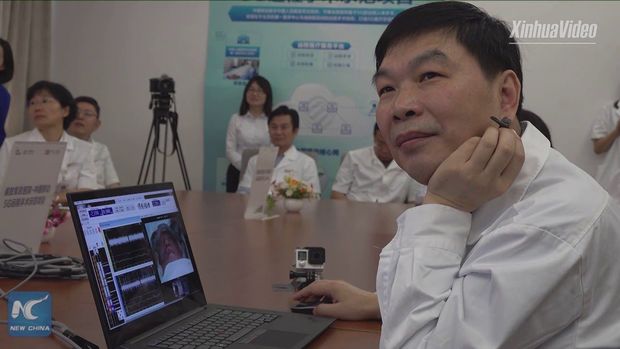 Çinli cərrah xəstədən 3000 kilometr məsafədə beyin əməliyyatı keçirdi - VİDEO