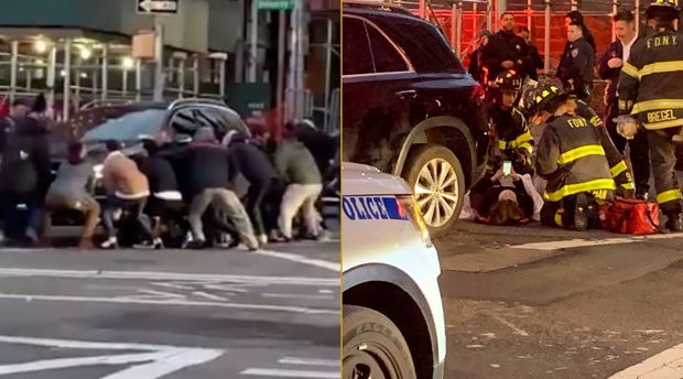 Maşını qaldıraraq, qadını belə çıxardılar - VİDEO