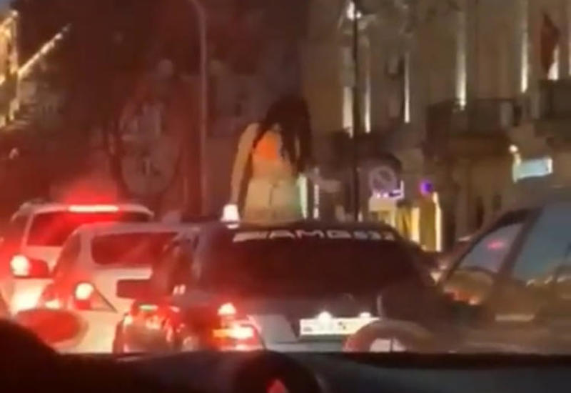 Bakıda qız avtomobilin damından çıxıb rəqs etdi -VİDEO