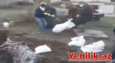 +18 İRANDAN DƏHŞƏTLİ GÖRÜNTÜLƏR YAYILDI: KORONOVİRUSDAN ÖLƏNLƏRİ QUYUYA ATIRLAR - VİDEO