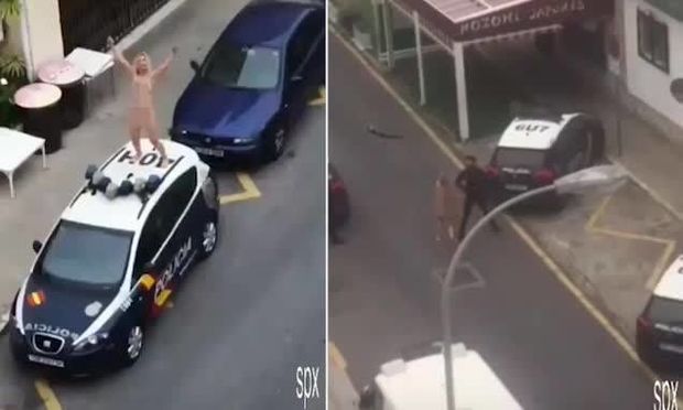 Испанка разделась и запрыгнула на полицейское авто в знак протеста против карантина - ВИДЕО