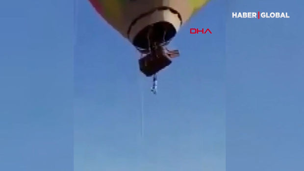 Hava şarının səbətindən asılı qalan kişinin həyatda qalma mübarizəsi - VİDEO