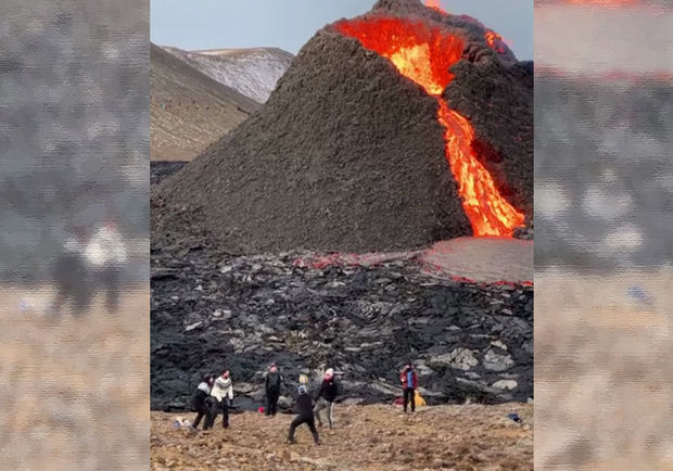Püskürən vulkanın qaynar lavaları fonunda topla oynadılar - VİDEO