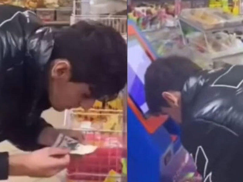 Pula tüpürərək ödəniş edən gənc polisə çağırıldı