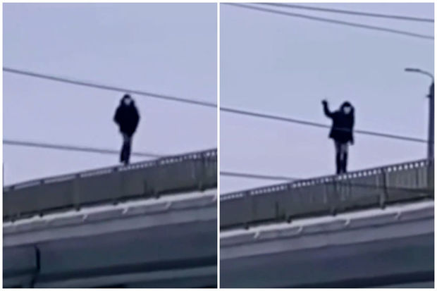 Rusiyada körpünün məhəccərləri üzərində yeriyən şəxs həyatını təhlükəyə atdı – VİDEO