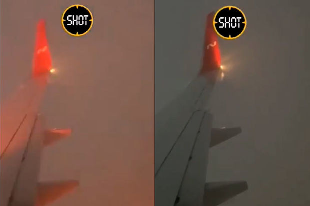 Təyyarənin sərnişini ildırımın düşmə anını telefonuna çəkdi - VİDEO