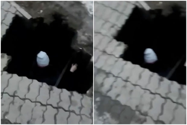 Rusiyada yer yarıldı: Qadın dəmir boruların üzərinə düşdü - VİDEO