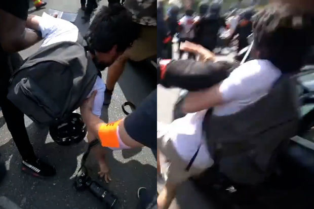 Fransa polisi fotoqrafı döyüb kamerasını sındırdı - VİDEO