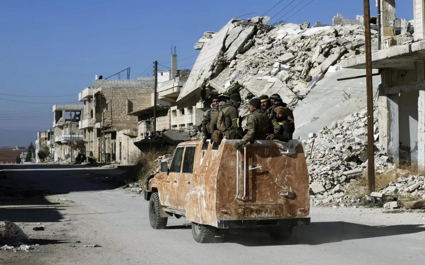 Suriya DİN keçmiş rejim üzvlərini silahları dərhal təhvil verməyə çağırıb