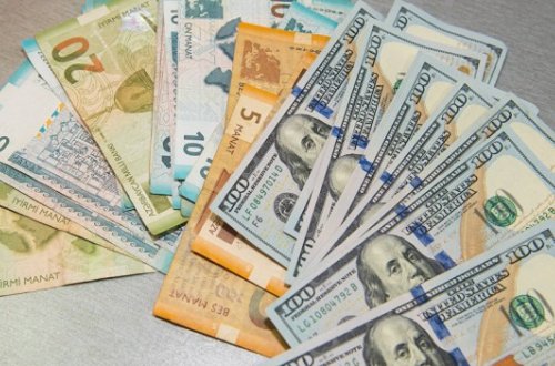 1 dollar 2 manat 50 qəpik..