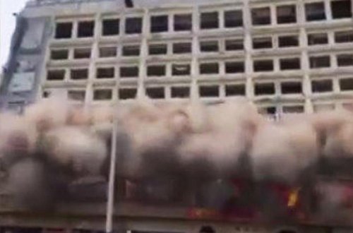 Çində 12 mərtəbəli bina uçdu - VİDEO