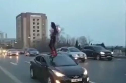 Bakıda gənc qız avtomobilin üzərində hoqqadan çıxdı - VİDEO