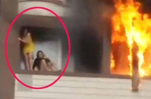 Özünü binadan atan qızı göydə tutan kişi: 