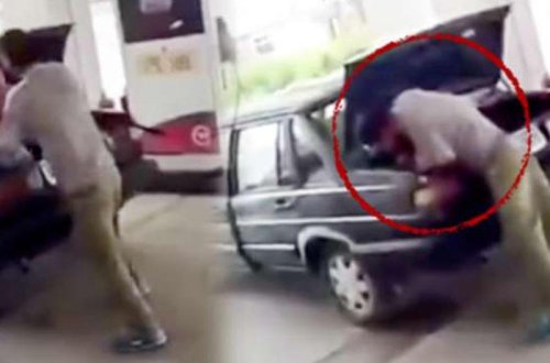 Həyat yoldaşını zorla maşının baqajına saldı - VİDEO