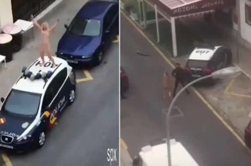 Испанка разделась и запрыгнула на полицейское авто в знак протеста против карантина - ВИДЕО