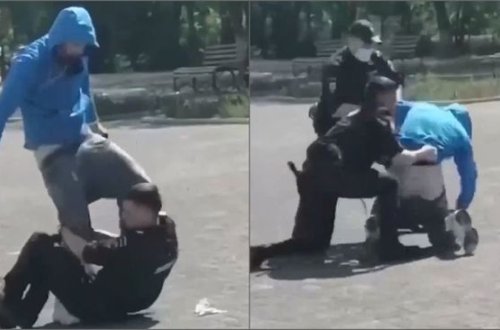 Polis maskasız gəncin dizlərindən yapışdı - VİDEO