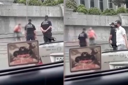 Gənc kişi Milli Məclisin binasının qarşısında özünü bıçaqladı - VİDEO