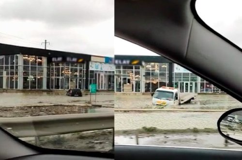 Bakıda suda batmış maşını çıxarmağa gələn evakuator da suda ilişib qaldı - VİDEO