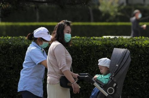 В Китае отменили штрафы за рождение третьего ребенка