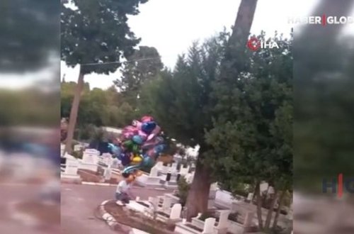 Uşaq qəbirlərinə şarlar bağlayıb insanları duyğulandırdı - VİDEO