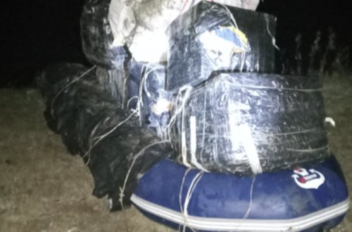 Sərhədçiləri görüb özlərini qayıqdan Kürə atdılar - Foto