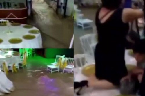 Toyda masanın üstünə çıxaraq seldən xilas olmağa çalışdılar - VİDEO