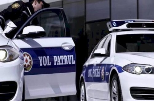 Polis avtomobilinin üzərinə benzin töküb yandırmaqla hədələdi
