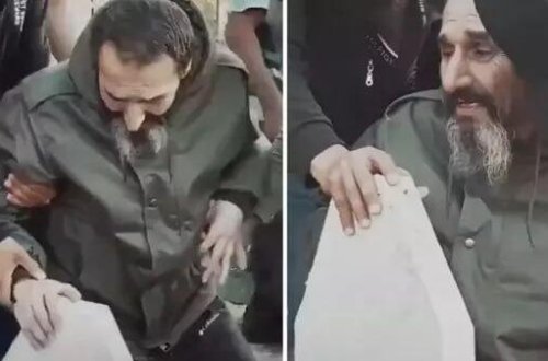 Əsəd tərəfindən öldürülən oğullarının məzarı başında görüntüsü ürək dağladı - VİDEO