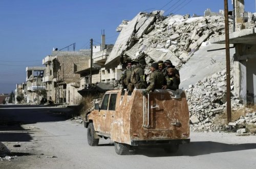 Suriya DİN keçmiş rejim üzvlərini silahları dərhal təhvil verməyə çağırıb